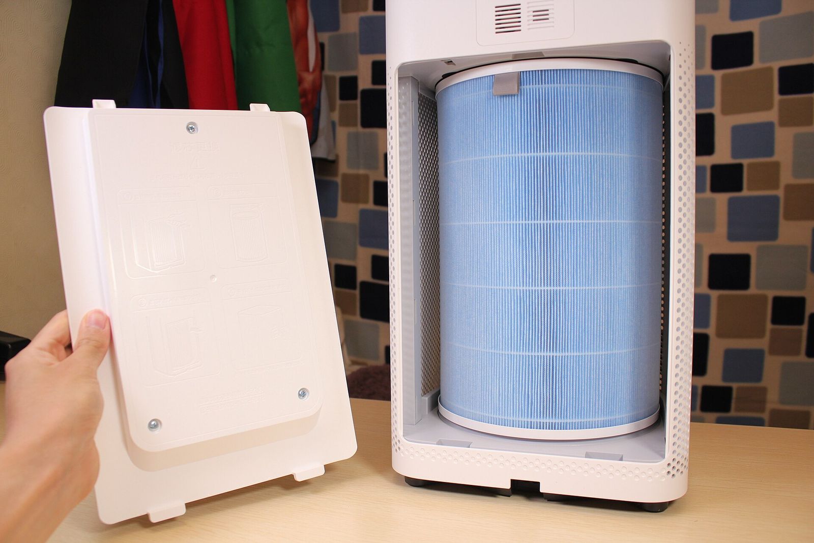 Air purifier with its cover removed, showing a cylindrical filter