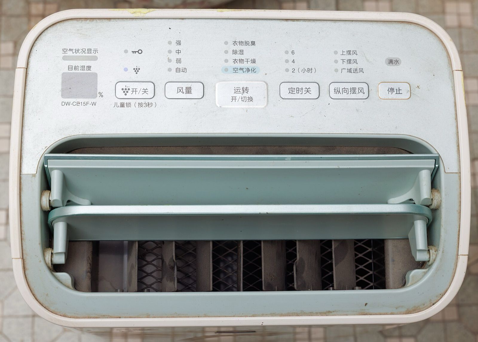 Control panel and air outlet louvre on top of a home dehumidifier