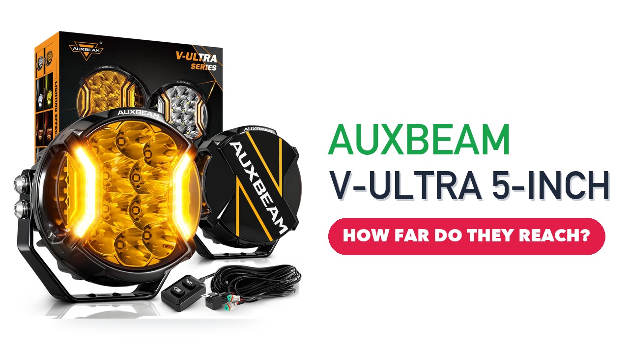 Two Auxbeam V-Ultra 5-inch round amber LED pod lights with a black cover and wiring harness in front of the box