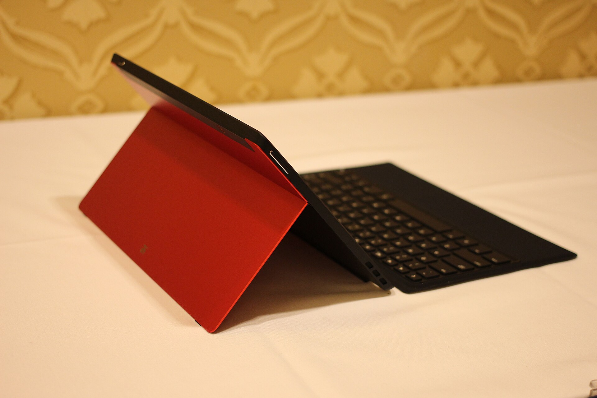 A large tablet propped on its stand with a detachable keyboard