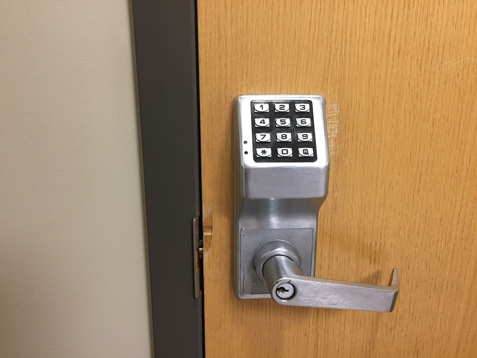 A keypad lever lock fitted to a wooden door