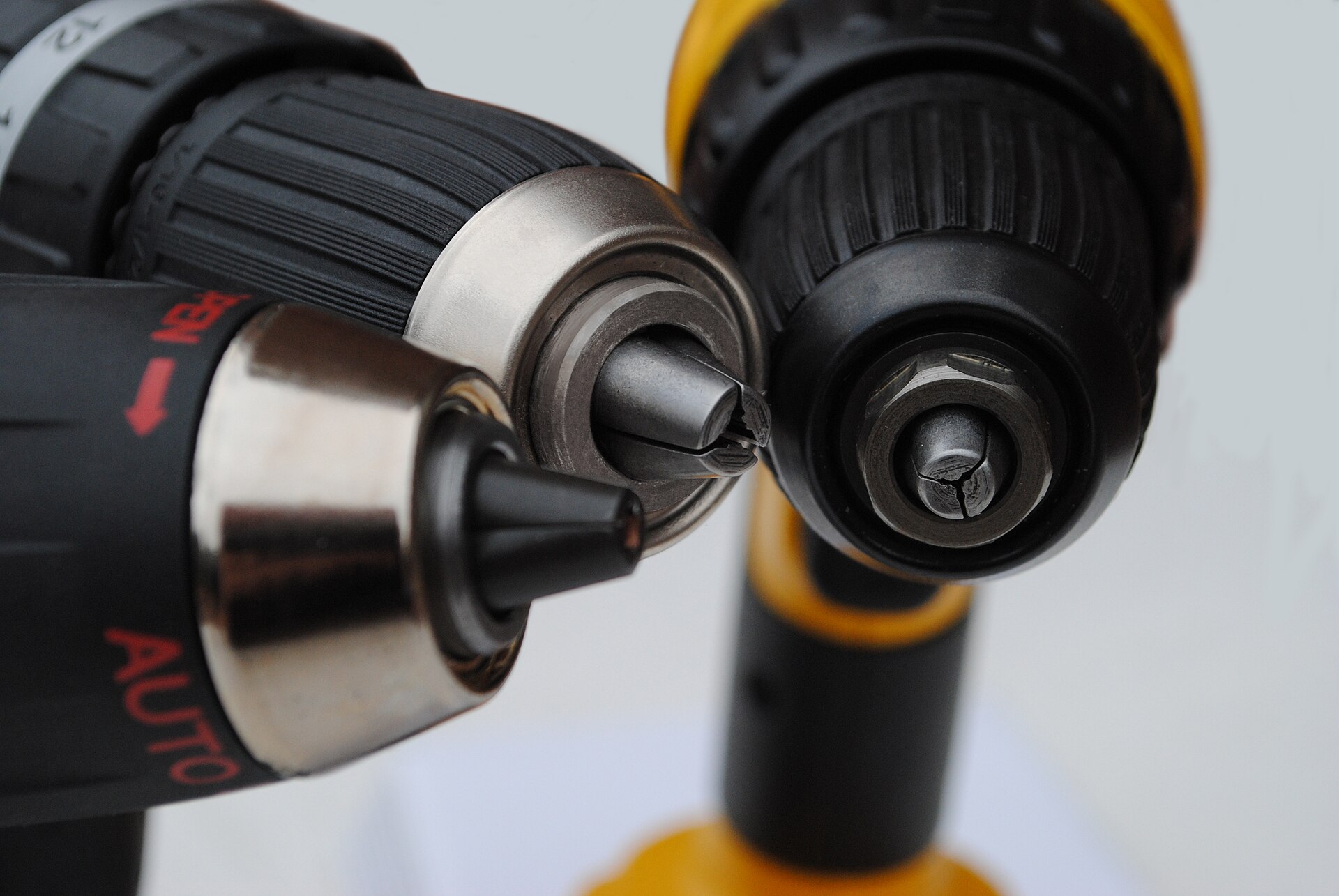 Close-up of the keyless chucks on two cordless drills