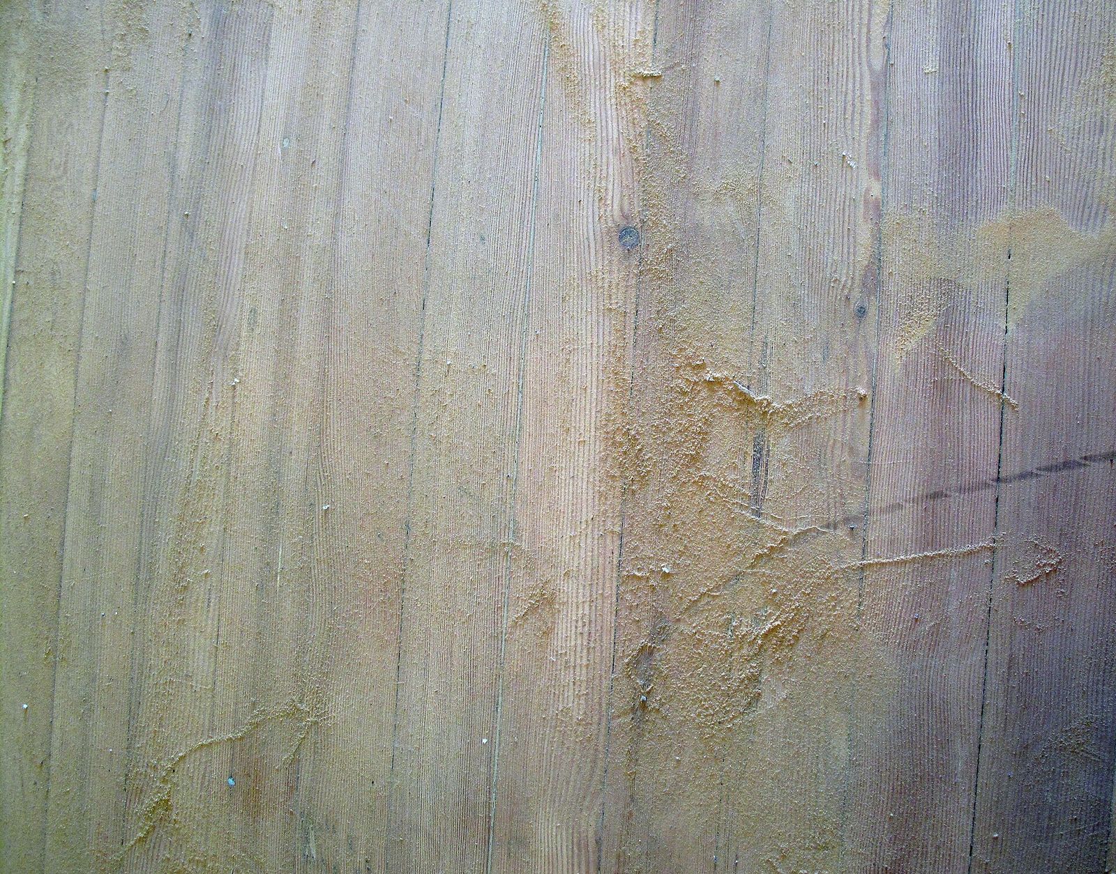 Fine sanding dust left on freshly sanded wooden boards