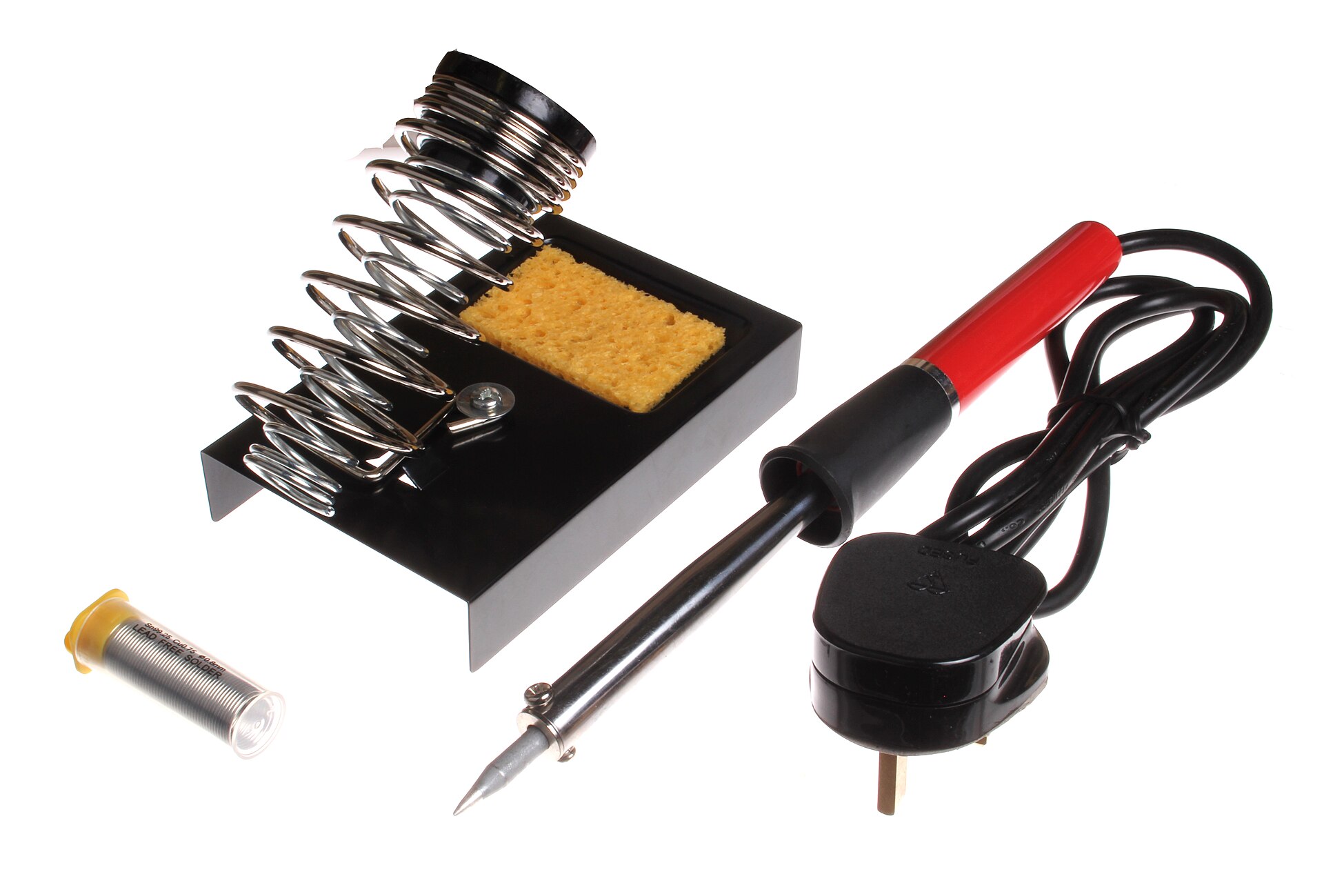 A pencil soldering iron beside a coiled iron stand with a cleaning sponge and a tube of solder