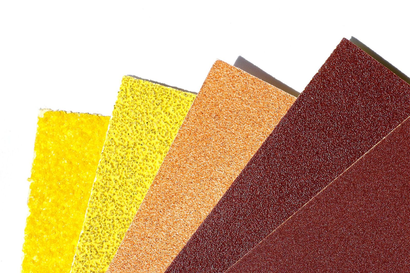 Sheets of sandpaper in a range of grits from coarse to fine