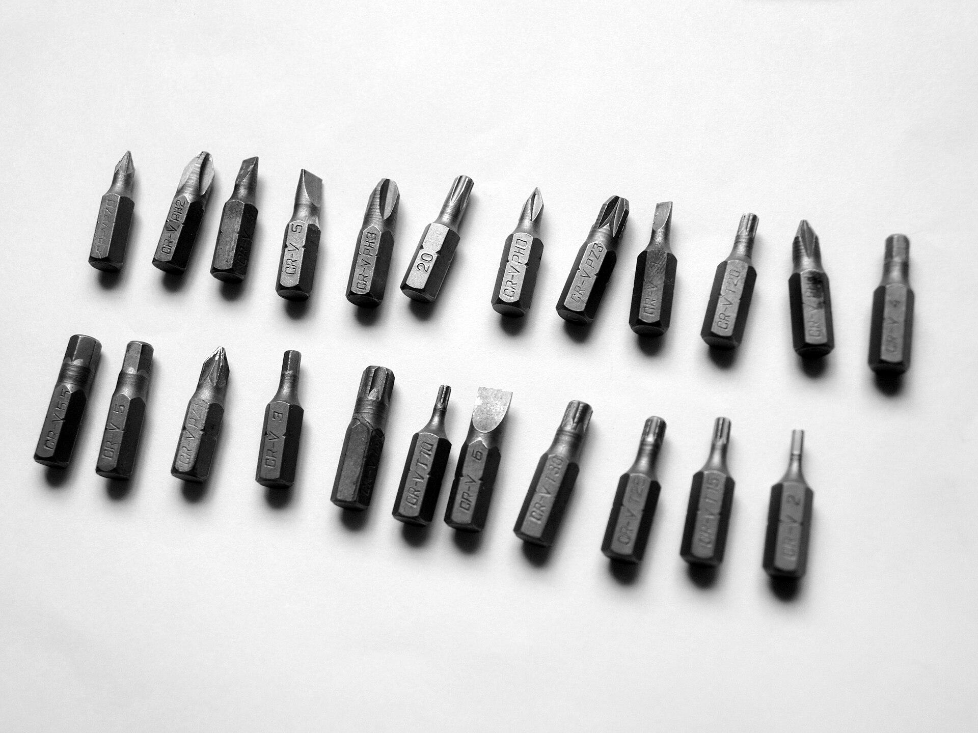 A double row of hex-shank screwdriver bits with slotted, Phillips, Pozidriv, Torx and hex tips
