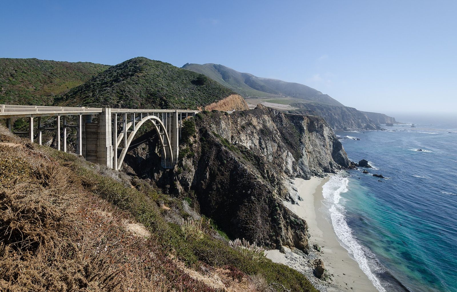 Bixby Creek Bridge's concrete arch spanning a canyon on Highway 1 along the Big Sur coast