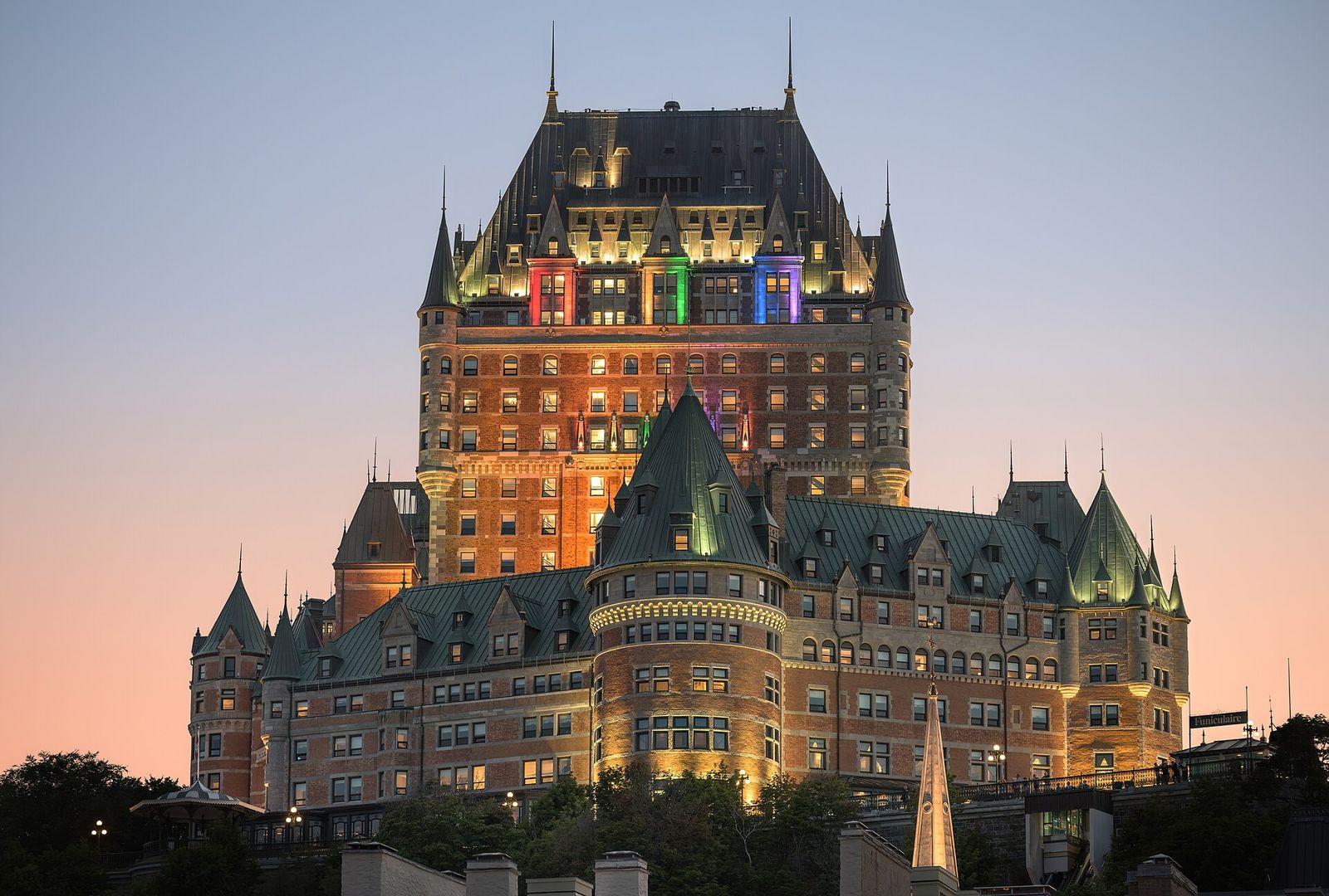 The Château Frontenac lit up at dusk on the cliff above Old Québec