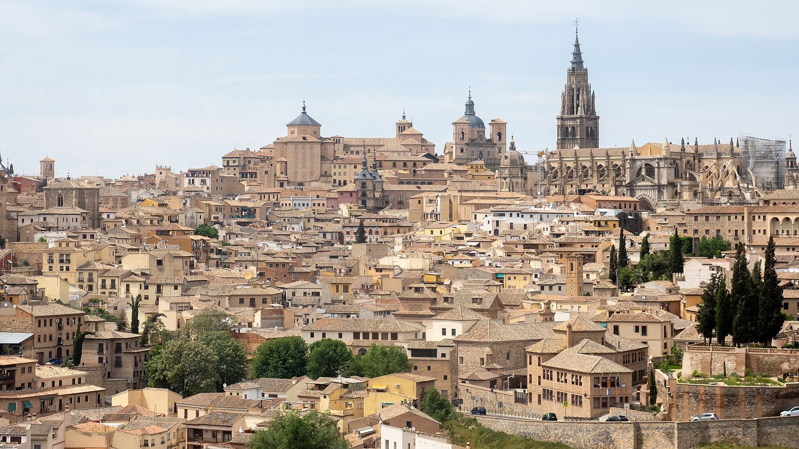 The old town of Toledo rising up its hill, with the Gothic cathedral tower on the skyline