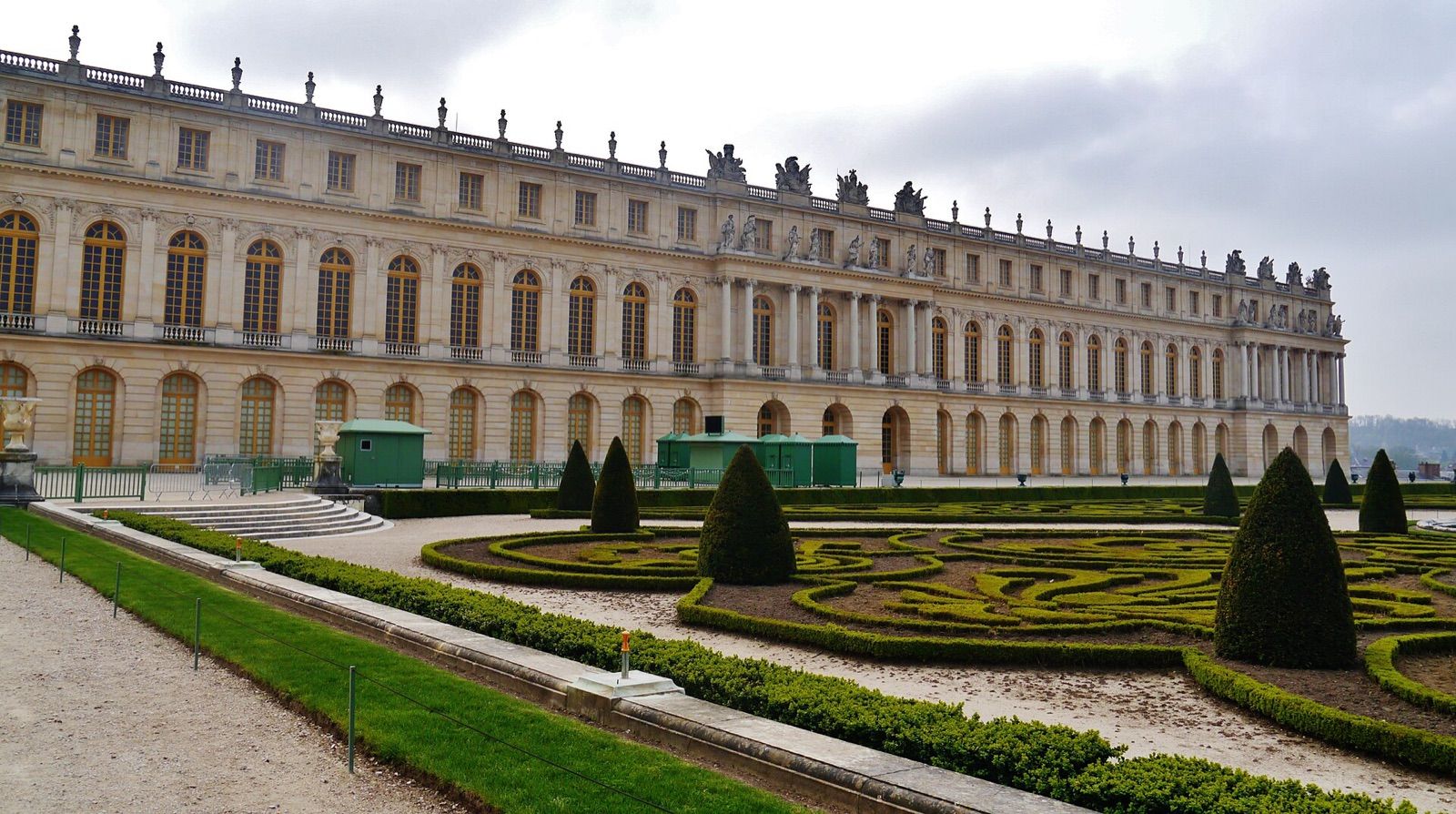 The garden façade of the Palace of Versailles above clipped formal parterres
