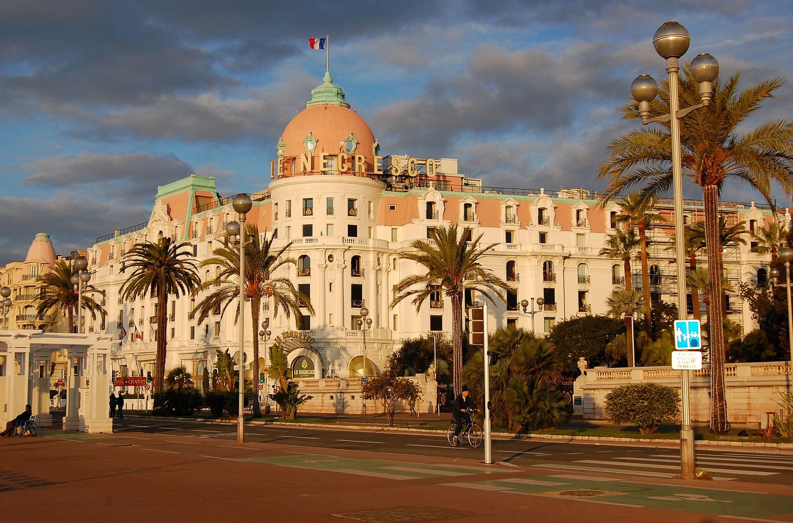 The white facade and pink dome of the Hotel Negresco on the Promenade des Anglais in Nice