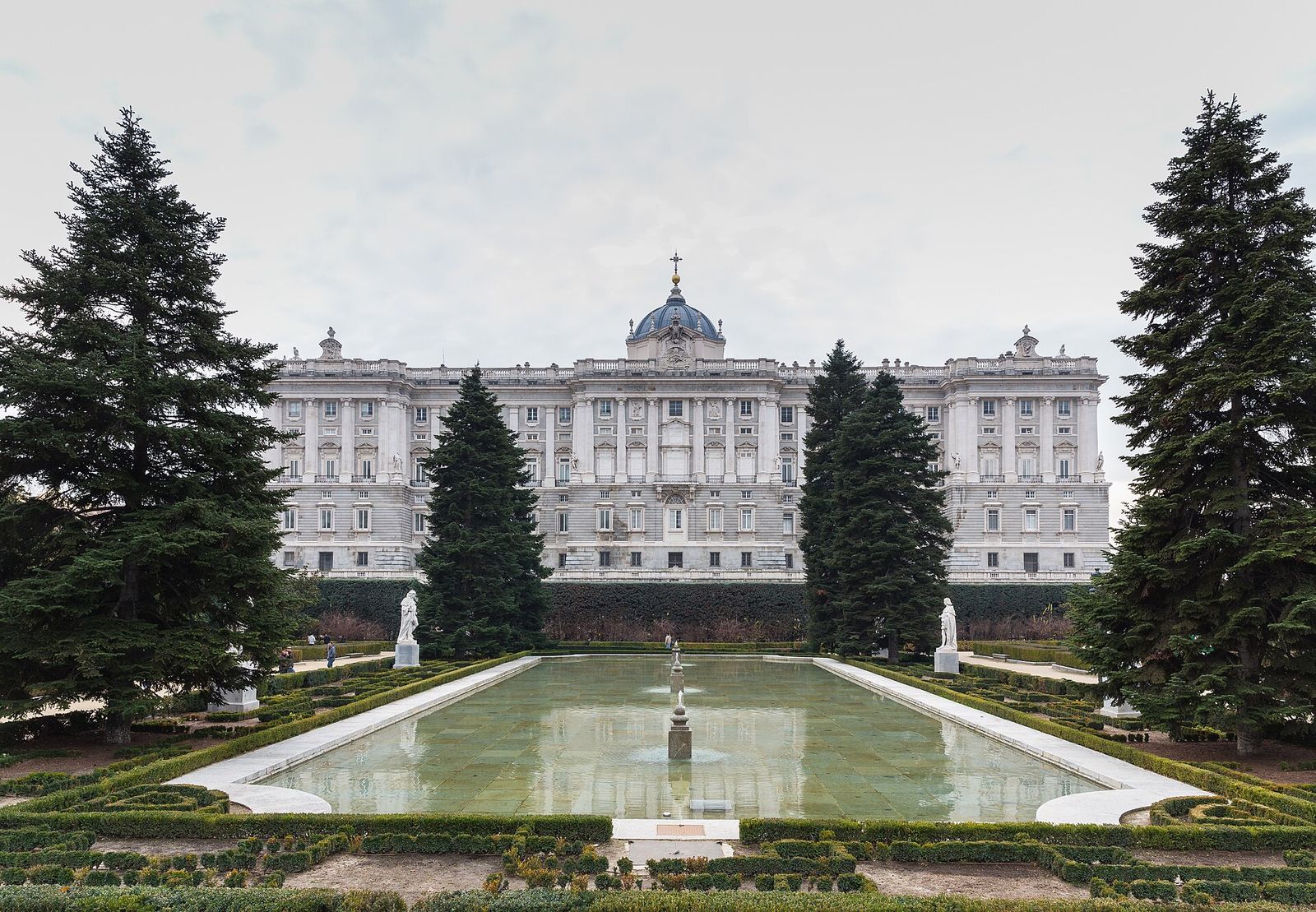 The Royal Palace of Madrid seen across the pool and clipped hedges of the Sabatini Gardens