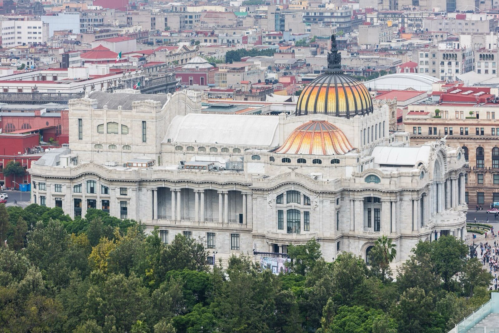The white marble Palacio de Bellas Artes and its domes among the rooftops of Mexico City's historic centre