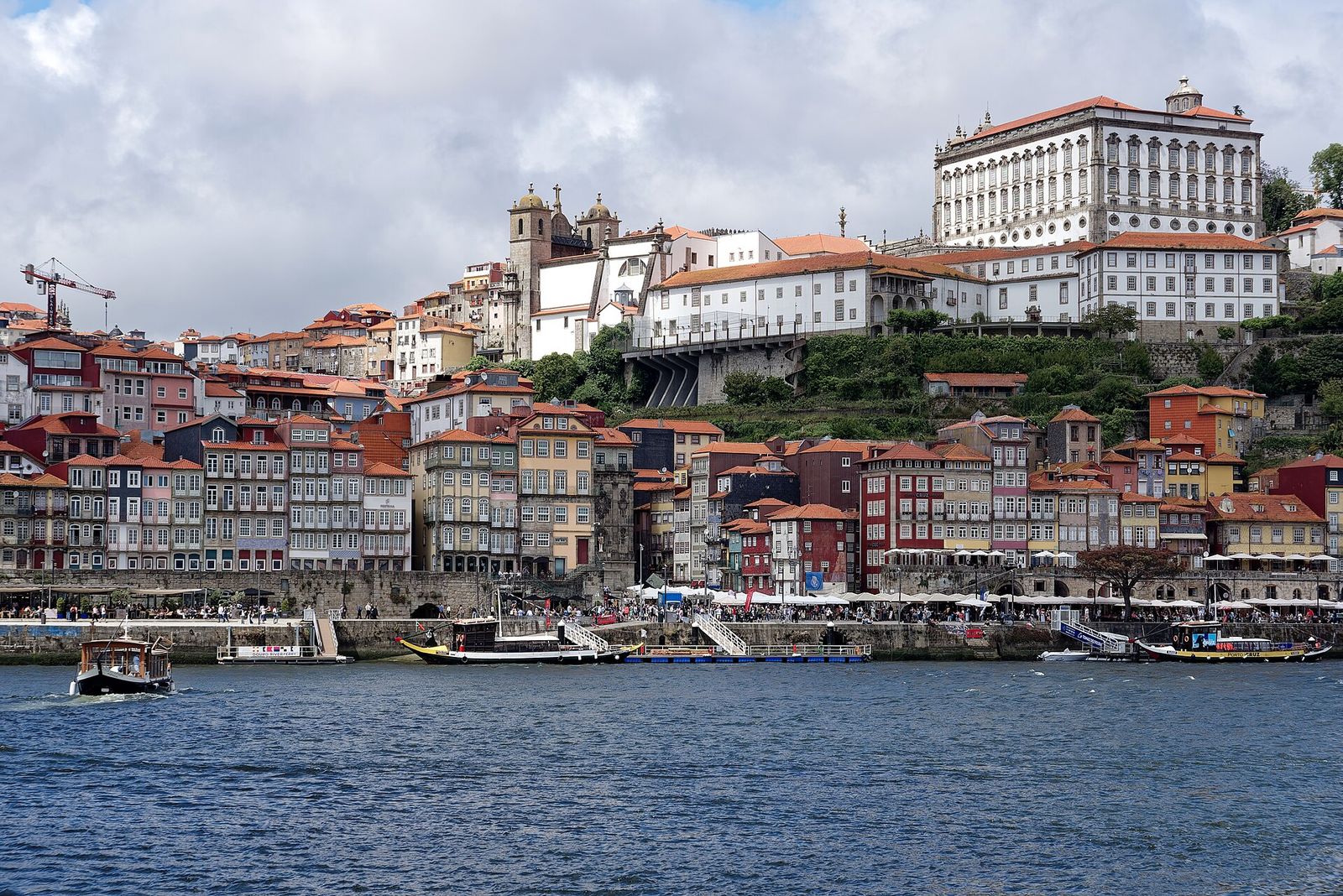 Porto's old town and cathedral rising above the Ribeira waterfront, seen across the Douro from Gaia