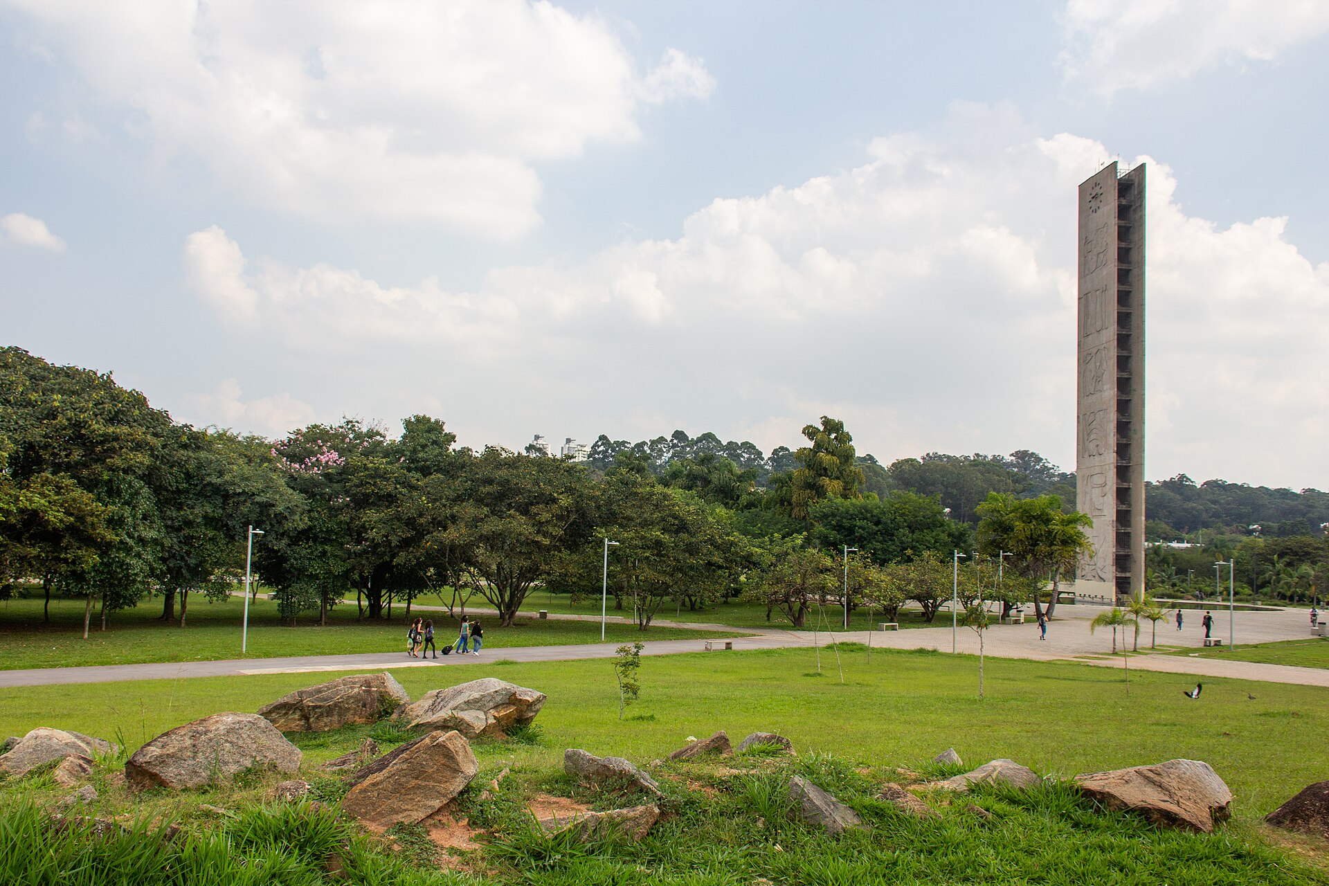 The concrete Clock Tower rising above the trees at the University of São Paulo