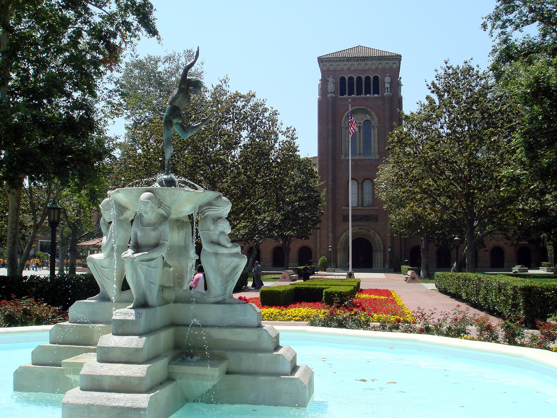 A fountain and the brick tower of the Bovard Administration Building at USC