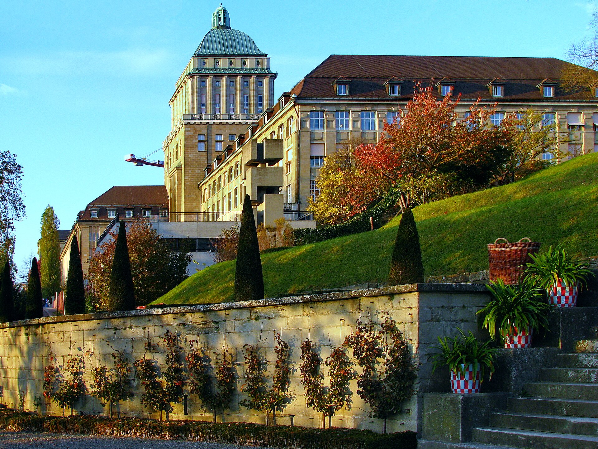 The tower of the University of Zurich's Main Building above terraced gardens