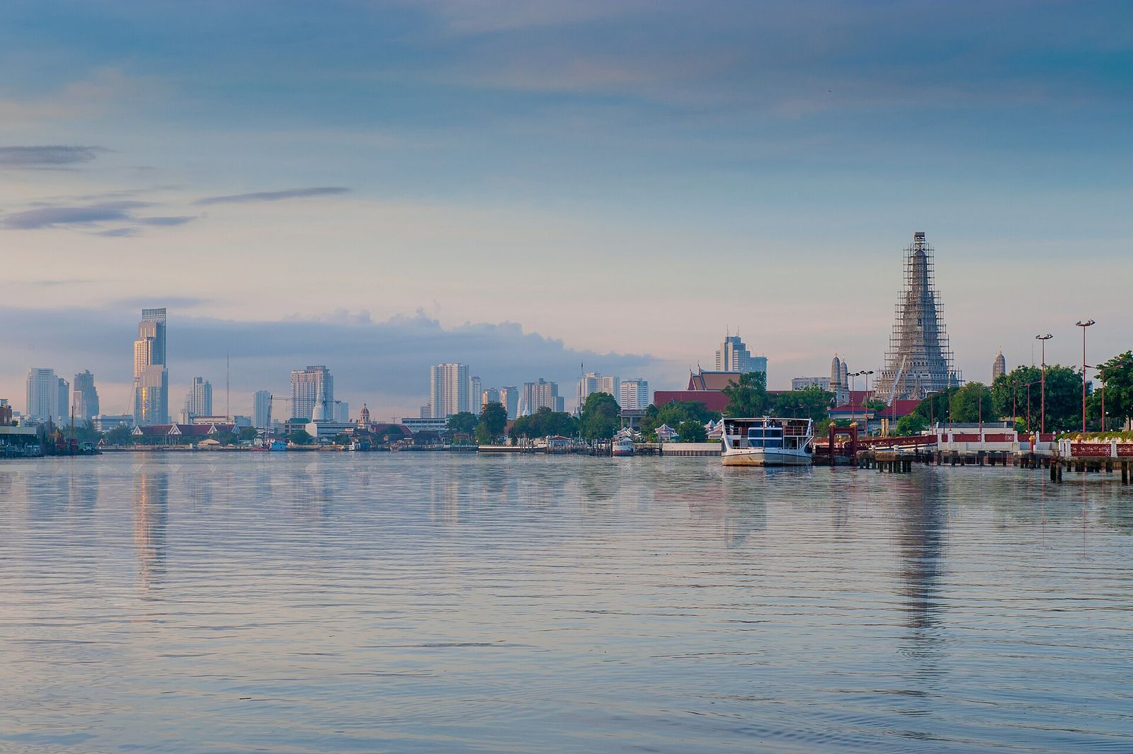 Wat Arun and the Bangkok skyline seen across the Chao Phraya River