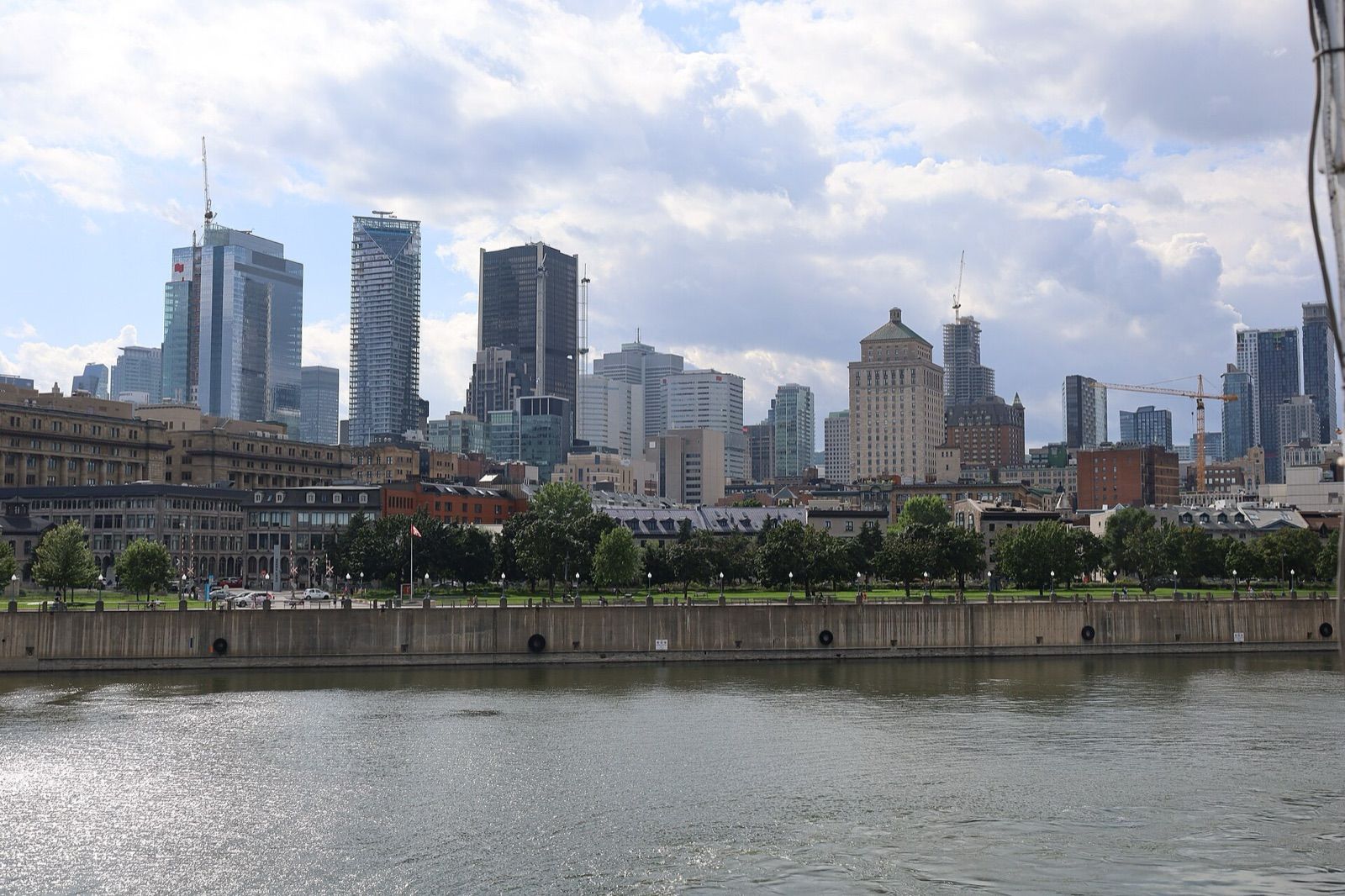 Old Montreal and the downtown skyline seen from the water of the Old Port